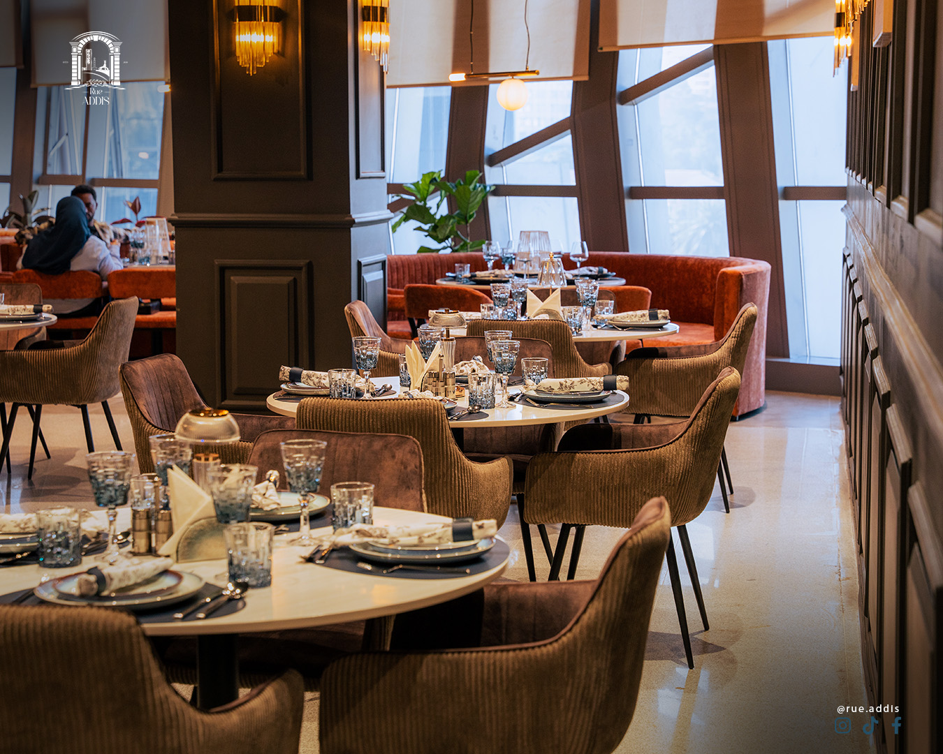 Chef plating a signature dish in a warm setting