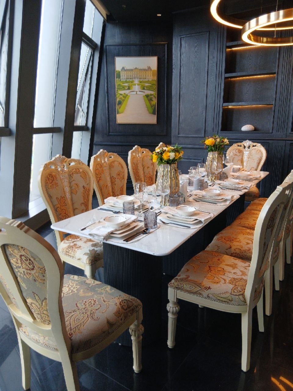 Chef plating a signature dish in a warm setting