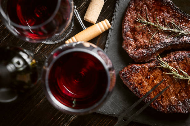 A dramatic drink presentation with steak night pairings
